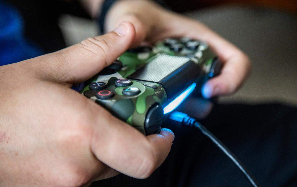Chase Carson, 15, plays Fortnite on a Playstation 4 gaming console at a friend’s home in Raleigh Wednesday, Sept. 23, 2020.