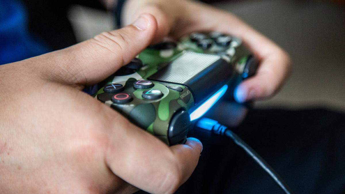Chase Carson, 15, plays Fortnite on a Playstation 4 gaming console at a friend’s home in Raleigh Wednesday, Sept. 23, 2020.
