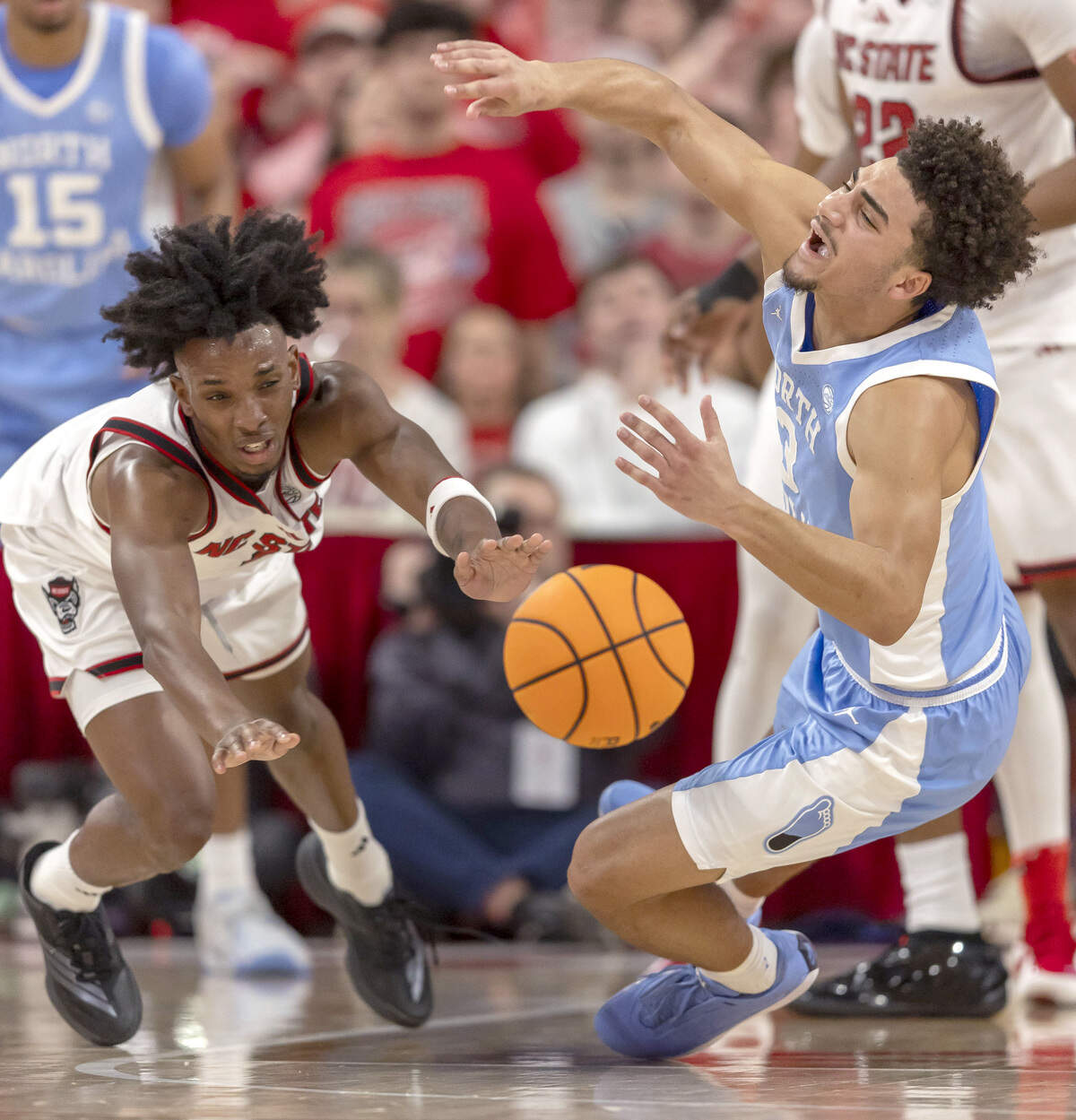 N.C State guard Paul McNeil Jr. (2) forces a turnover by North Carolina guard Derek Dixon (3) in the first half on Tuesday, February 17, 2026 at Lenovo Center in Raleigh, N.C.