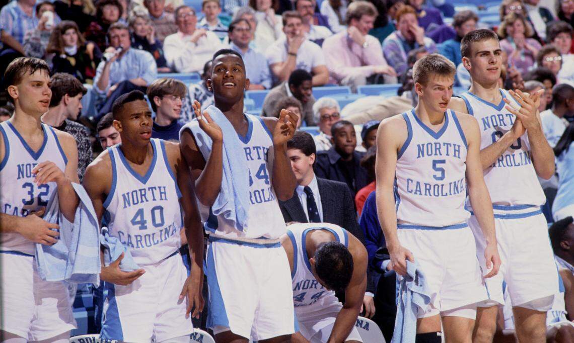 Hubert Davis (40) on the bench with fellow Tar Heels (from left): Pete Chillcutt (32), Davis, George Lynch (34), Rick Fox (44), Henrik Rodl (5) and Eric Montross (00).