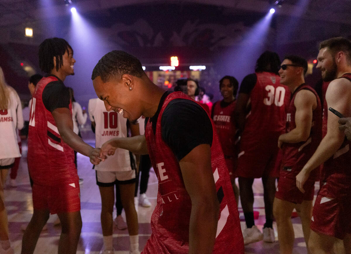 N.C. State men’s basketball players react following a dunk contest at the “Primetime with the Pack” preseason event on Thursday, Oct. 26, 2023, at Reynolds Coliseum in Raleigh, N.C.