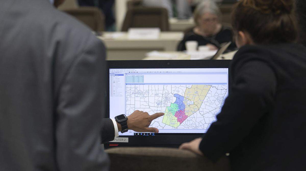 North Carolina Senate members study redistricting maps during a committee meeting on Thursday, September 12, 2019 at the Legislative Office Building in Raleigh, N.C.