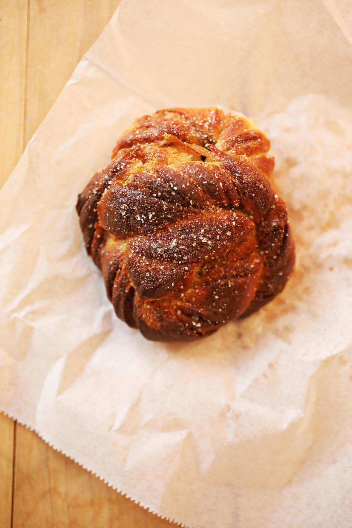 A fresh cardamom bun out of the wood-fired oven at Benchwarmers Bagels in Transfer Co. Food Hall.