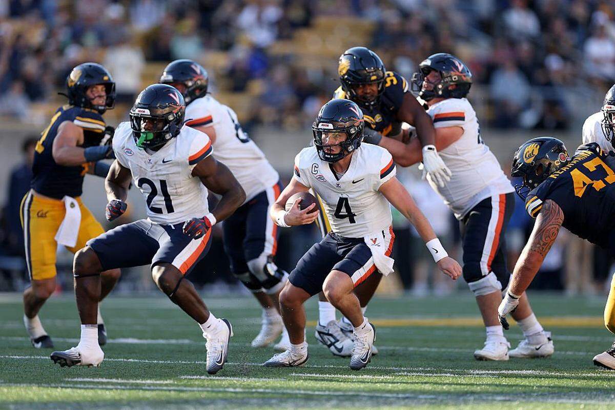 Chandler Morris (4) of the Virginia Cavaliers runs with the ball against the California Golden Bears during the second half at California Memorial Stadium on November 01, 2025 in Berkeley, California. 