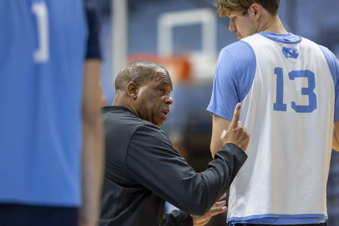 Coach Hubert Davis works with center Henri Veesaar (13) during practice on Thursday, October 9. 2025 at the Smith Center in Chapel Hill, N.C.