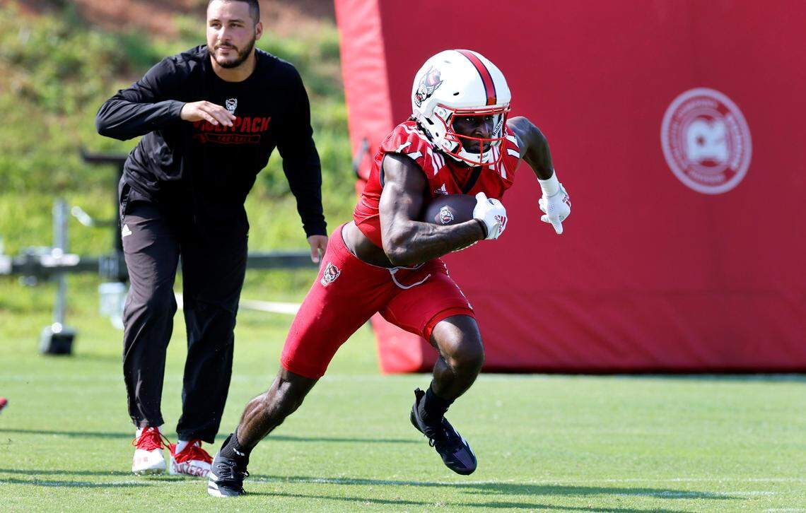 N.C. State’s Jonathan Paylor (14) runs back the ball during the Wolfpack’s first practice in Raleigh, N.C., Wednesday, July 31, 2024.