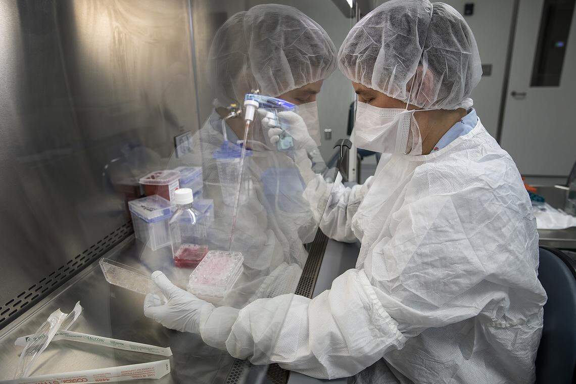 A technician works at UNC Lineberger’s advanced cellular therapeutics facility, which is where chimeric antigen receptor T-cell immunotherapy is developed specifically for a person’s cancer.
