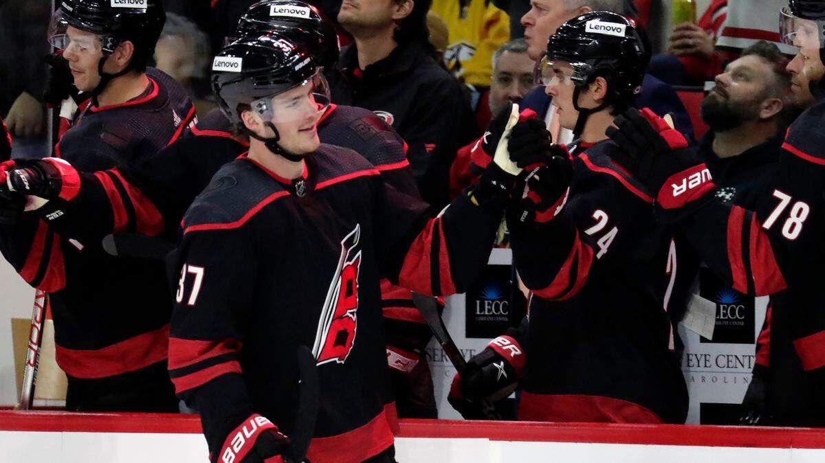 Carolina Hurricanes right wing Andrei Svechnikov (37) celebrates his goal against the Nashville Predators as he comes back to the bench during the third period of an NHL hockey game Friday, Feb. 18, 2022, in Raleigh, N.C. (AP Photo/Chris Seward)