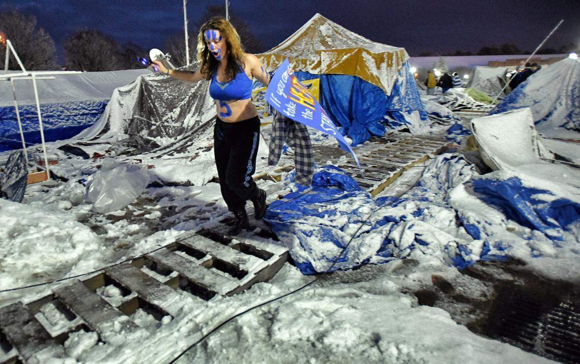 Martina Stojanvska heads out of her tent in Krzyzewskiville to join up with friends prior to the game against the Tar Heels outside Cameron Indoor Stadium in Durham, NC Wednesday, Feb. 18, 2015.