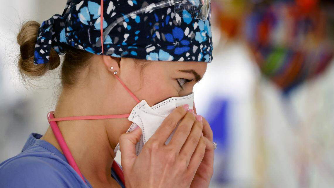 Erica South, a nurse in the emergency department at UNC REX Hospital, tightly positions her N95 mask.