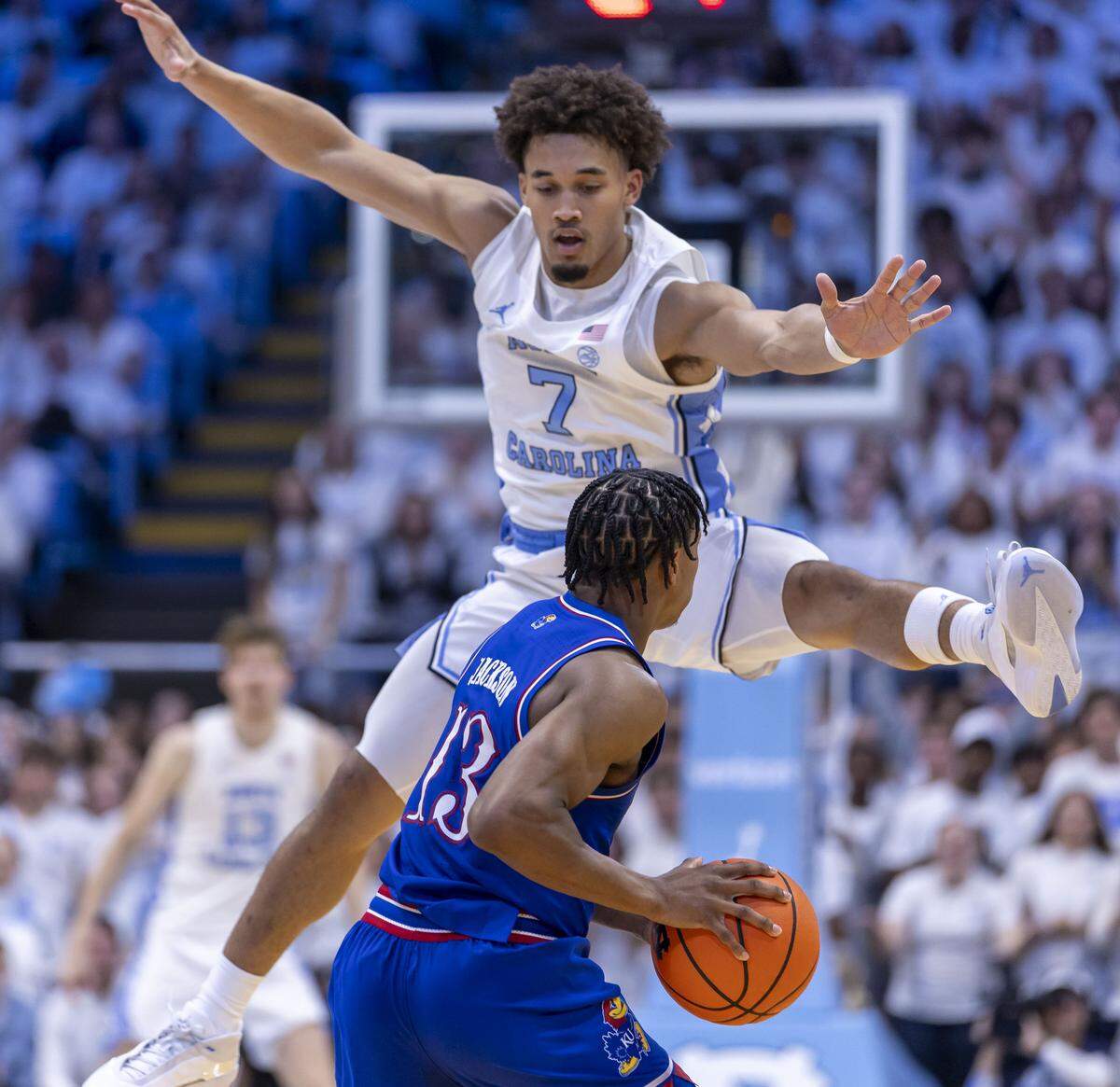 North Carolina guard Seth Trimble (7) traps Kansas guard Elmarko Jackson (13) in the first half, forcing a turnover,  on Friday, November 7, 2025 at the Smith Center in Chapel Hill, N.C.