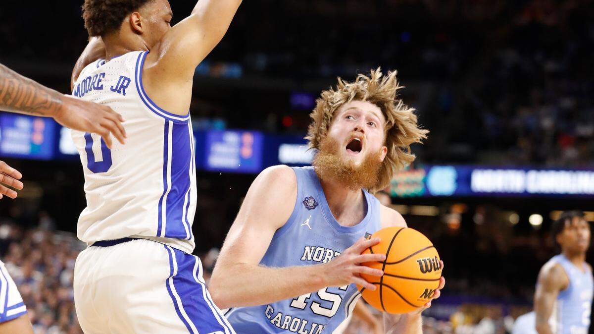 North Carolina’s Brady Manek (45) looks to shoot as Duke’s Wendell Moore Jr. (0) defends during the first half of Duke’s game against UNC in the Final Four at Caesars Superdome in New Orleans, La., Saturday, April 2, 2022.