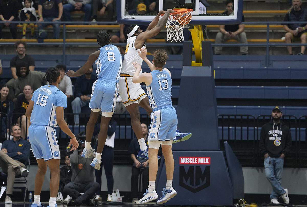 California’s Lee Dort (34) dunks over Caleb Wilson (8) and Henri Veesaar (13) of North Carolina in the first half at Haas Pavilion on Jan. 17, 2026, in Berkeley, California.