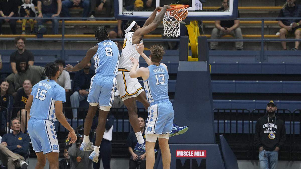 California’s Lee Dort (34) dunks over Caleb Wilson (8) and Henri Veesaar (13) of North Carolina in the first half at Haas Pavilion on Jan. 17, 2026, in Berkeley, California.