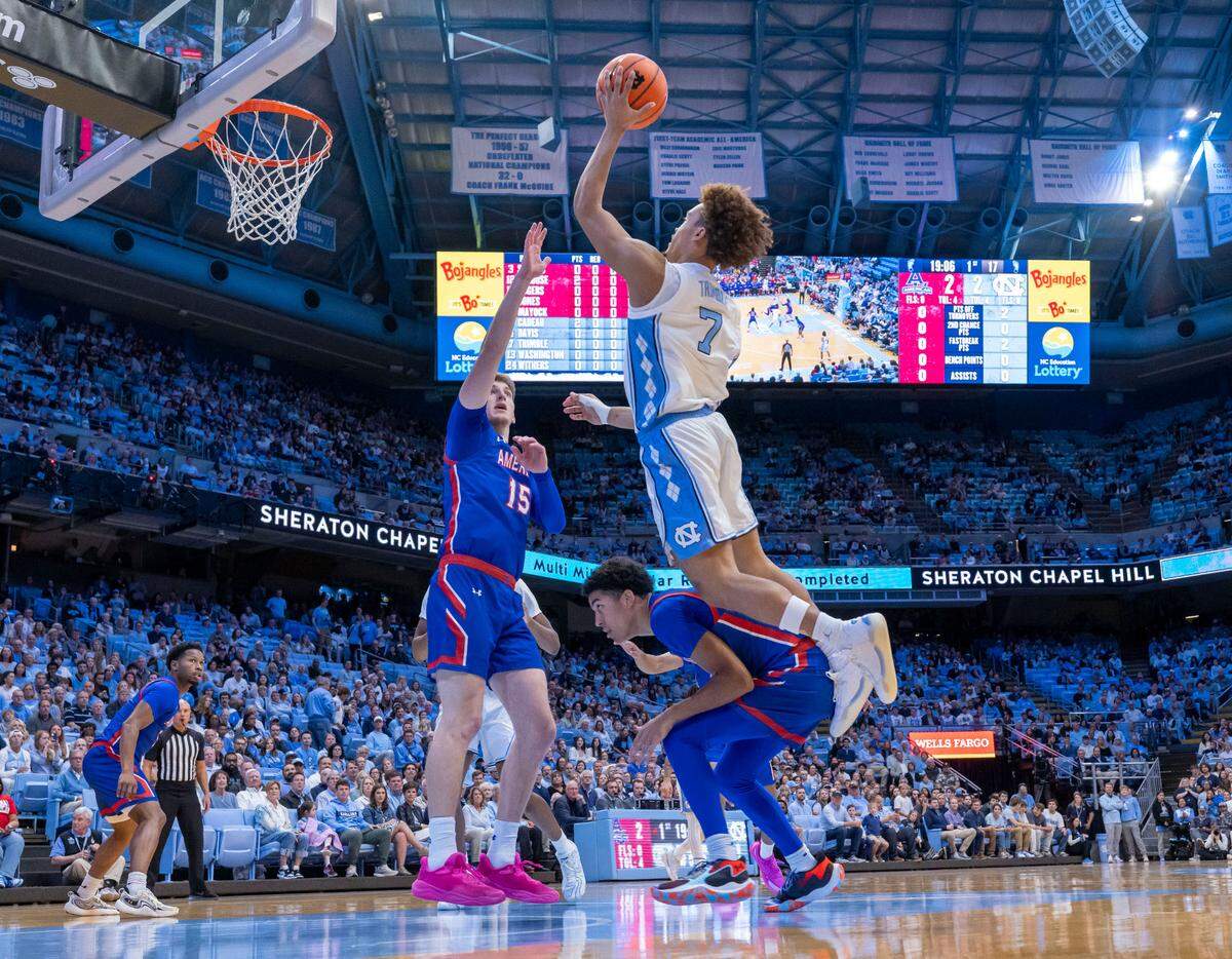 North Carolina guard Seth Trimble (7) breaks to the basket against American University’s John Holbrook (15) and Greg Jones (23) in the first half on Friday, November 15, 2024 at the Smith Center in Chapel Hill, N.C.