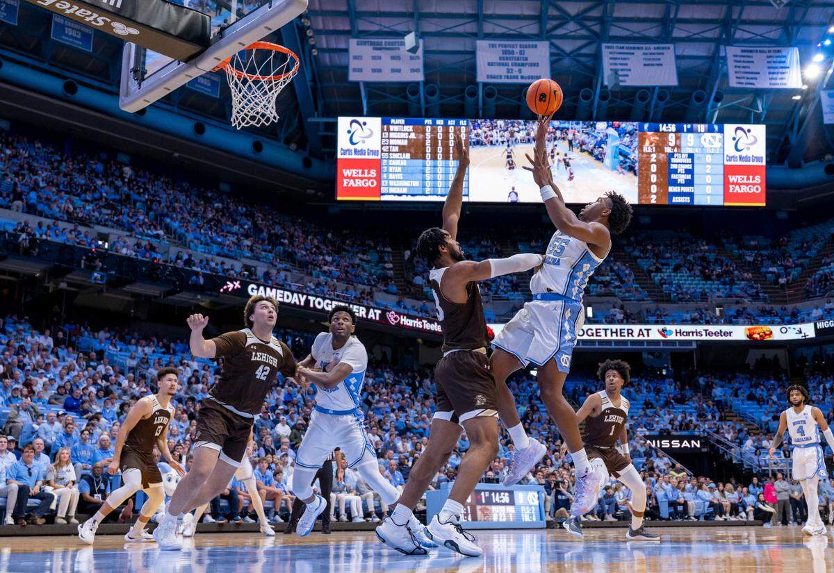 North Carolina’s Harrison Ingram (55) puts up a shot against Lehigh’s Bube Momah (23) in the first half on Sunday, November 12, 2023 at the Smith Center in Chapel Hill, N.C. Ingram scored 14 points in the Tar Heels’ 90-68 victory.