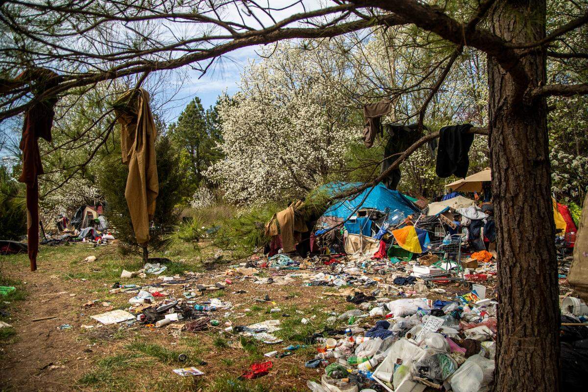 A homeless camp between Interstate 540 and an exit ramp to Capital Boulevard as it looked in March 2021.