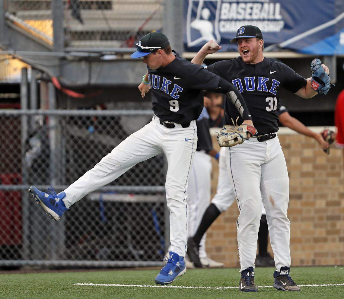 Duke's Griffin Conine (9) and Graeme Stinson (31) celebrate during an NCAA college baseball tournament super regional game against Texas Tech on Sunday, June 10, 2018, in Lubbock, Texas.