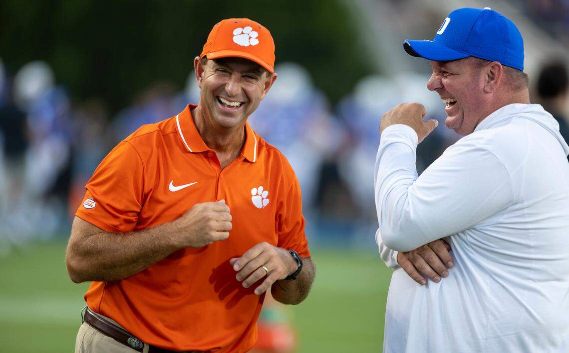 Clemson coach Dabo Swinney and Duke coach Mike Elko enjoy a laugh together prior to their game on Monday, September 4, 2023 at Wallace Wade Stadium Stadium in Durham, N.C.