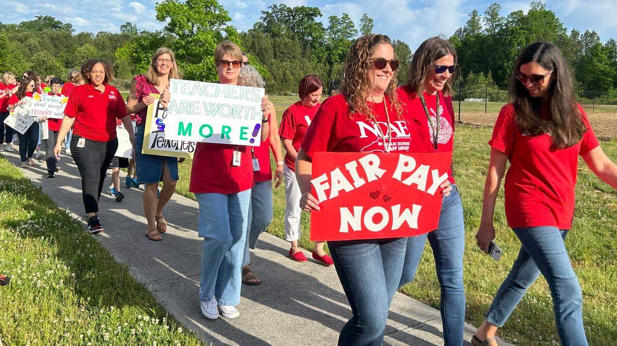 Teachers hold a “walk-in” at Abbotts Creek Elementary School in Raleigh, N.C., on April 30, 2024 to lobby the Wake County school board to include bigger raises in the school budget.