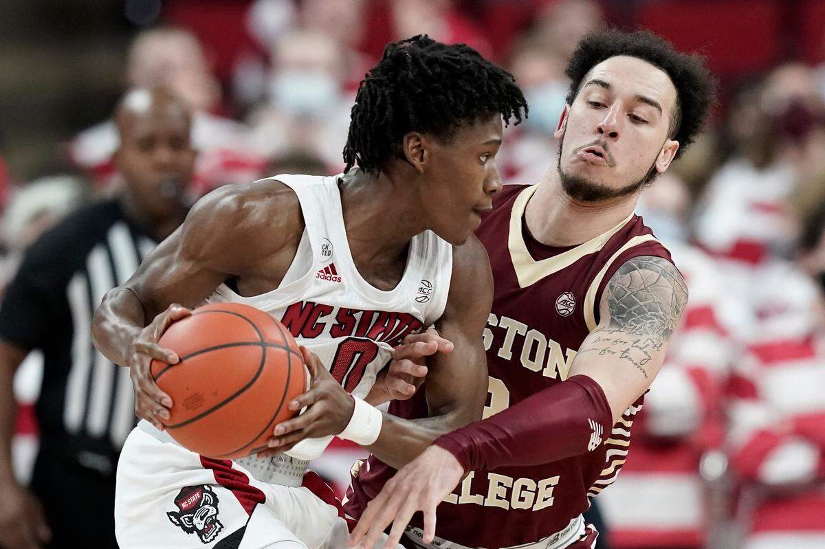 Boston College guard Jaeden Zackery defends against North Carolina State guard Terquavion Smith (0) during the first half of an NCAA college basketball game in Raleigh, N.C., Wednesday, Feb. 23, 2022.