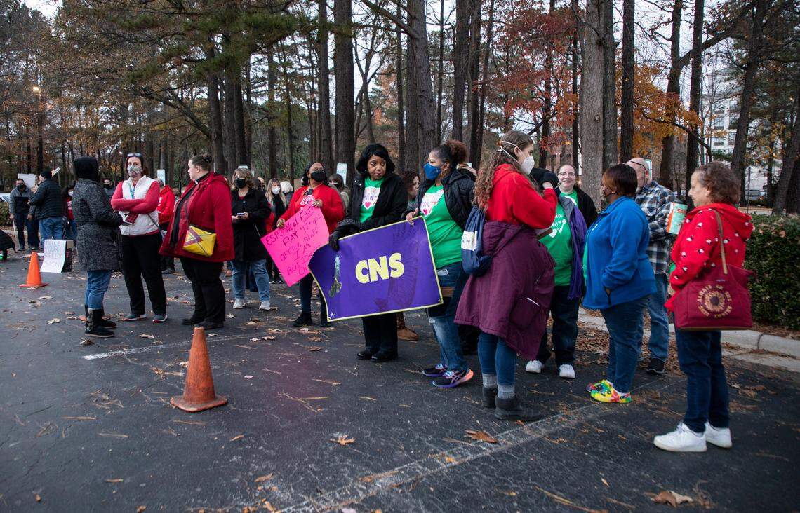 Educators, school support staff and their supporters rally outside the Wake County School Board meeting in Cary, N.C. on Tuesday, Dec. 7, 2021.