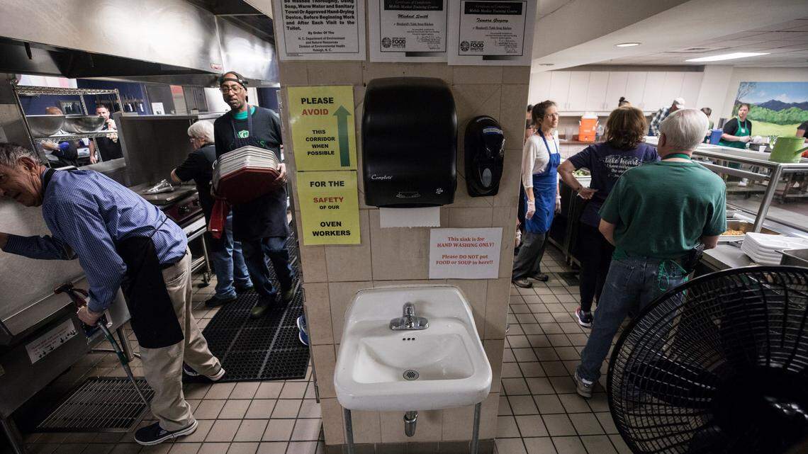Volunteers at Shepherd’s Table Soup Kitchen begin cleaning up as lunch service ends in downtown Raleigh on Friday, March 13. There’s been a decrease in volunteers as more people work from home and limit social interactions amid fears of coronavirus.
