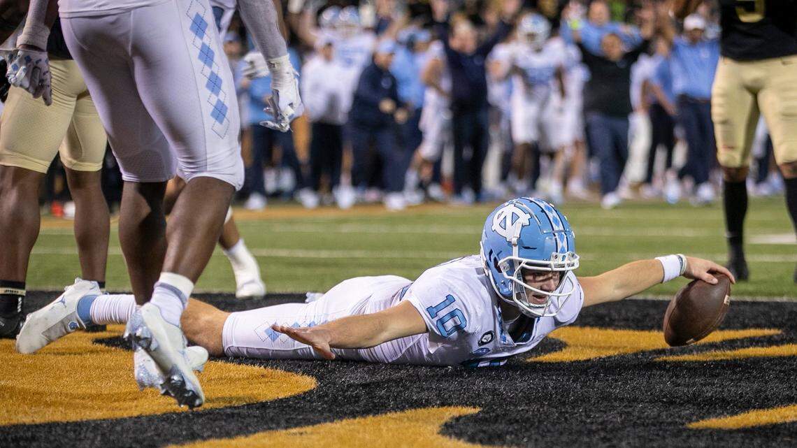 North Carolina quarterback Drake Maye (10) reacts after scoring on a five-yard run to give the Tar Heels a 33-28 lead in the third quarter against Wake Forest on Saturday, November 12, 2022 at Truist Field in Winston-Salem, N.C.