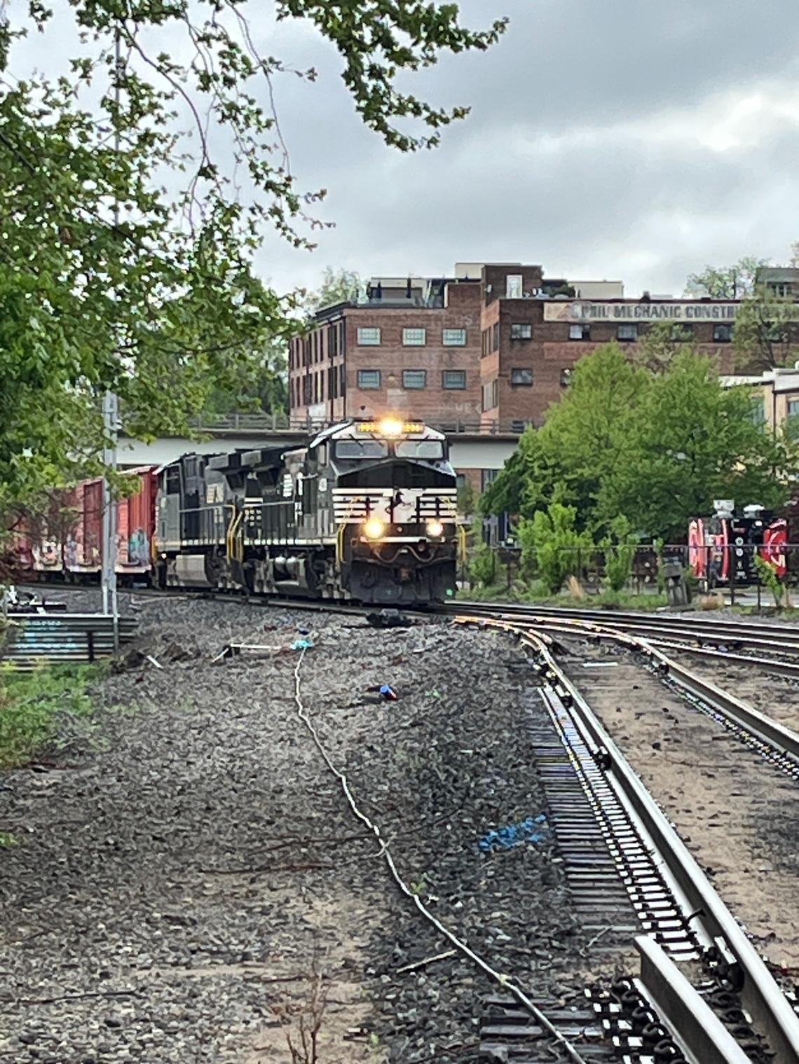 A Norfolk Southern train passes through the River Arts District in Asheville as it approaches the company’s freight yard.