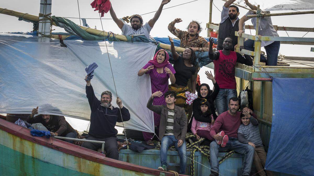 In the middle of the Timor Sea, five Australians on a yacht try to help a boatload of asylum seekers by towing them. When the rope is cut between them, and seven people die as a result, it sets up a mystery that reignites several years later, when they meet again. Yasmeen Al-Bayati (Maha Riad), Zahra Al-Bayati (Nicole Chamoun), Bilal Al-Bayat (Robert Rabiah) and Ismail Al-Bayati (Hazem Shammas) shown.