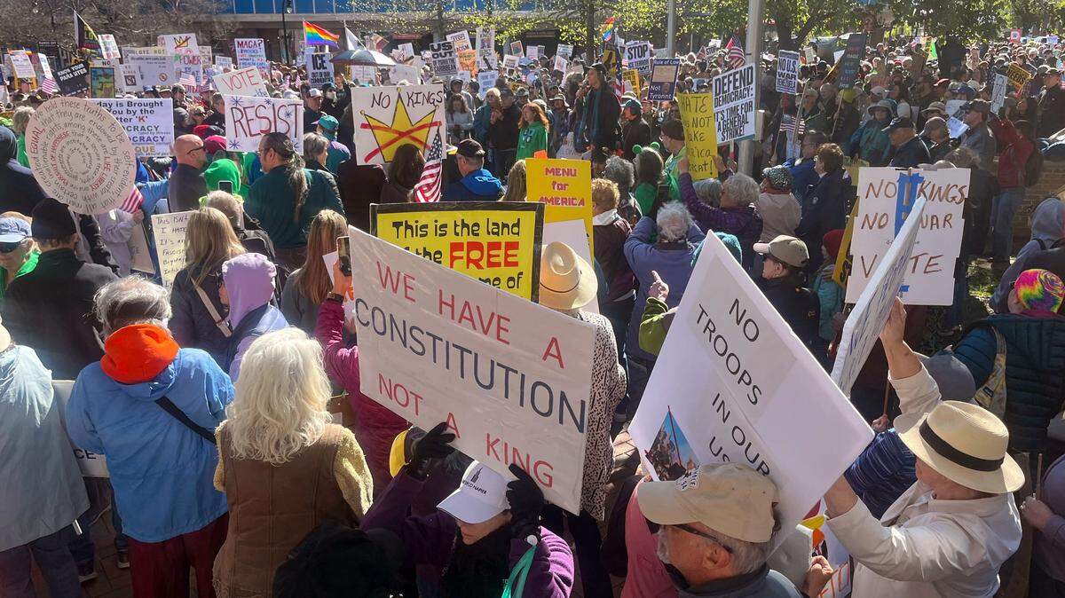 People gather in downtown Durham to participate in Saturday’s “No Kings” protests against President Donald Trump and his policies.
