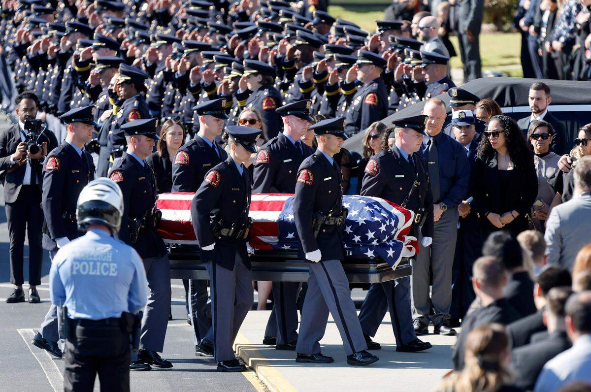 The casket of Raleigh Police Officer Gabriel Torres is brought into Cross Assembly Church in Raleigh, N.C. during his funeral Saturday, Oct. 22, 2022. Torres was killed in a mass shooting Oct. 13.