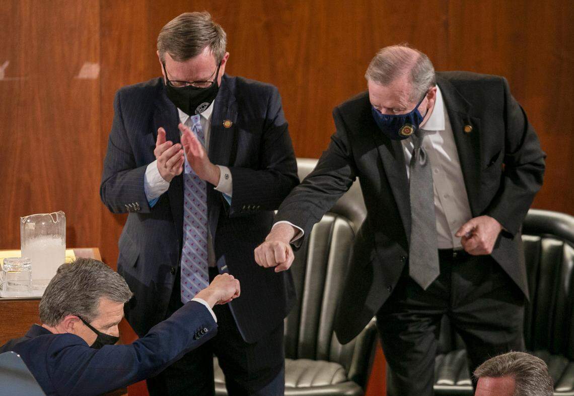 Senator Phil Berger fist bumps North Carolina Governor Roy Cooper after Cooper delivered his State of the State address before a joint session of the North Carolina House and Senate on Monday, April 26, 2021 in Raleigh, N.C.