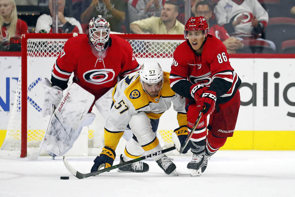 Carolina Hurricanes’ Teuvo Teravainen (86), of Finland, collides with Nashville Predators’ Dante Fabbro (57) during the third period of an NHL preseason hockey game in Raleigh, N.C., Friday, Sept. 27, 2019. (AP Photo/Karl B DeBlaker)