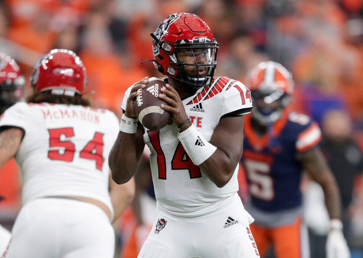 North Carolina State quarterback Jack Chambers (14) looks to pass during the first half of an NCAA college football game against Syracuse on Saturday, Oct. 15, 2022, in Syracuse, N.Y.