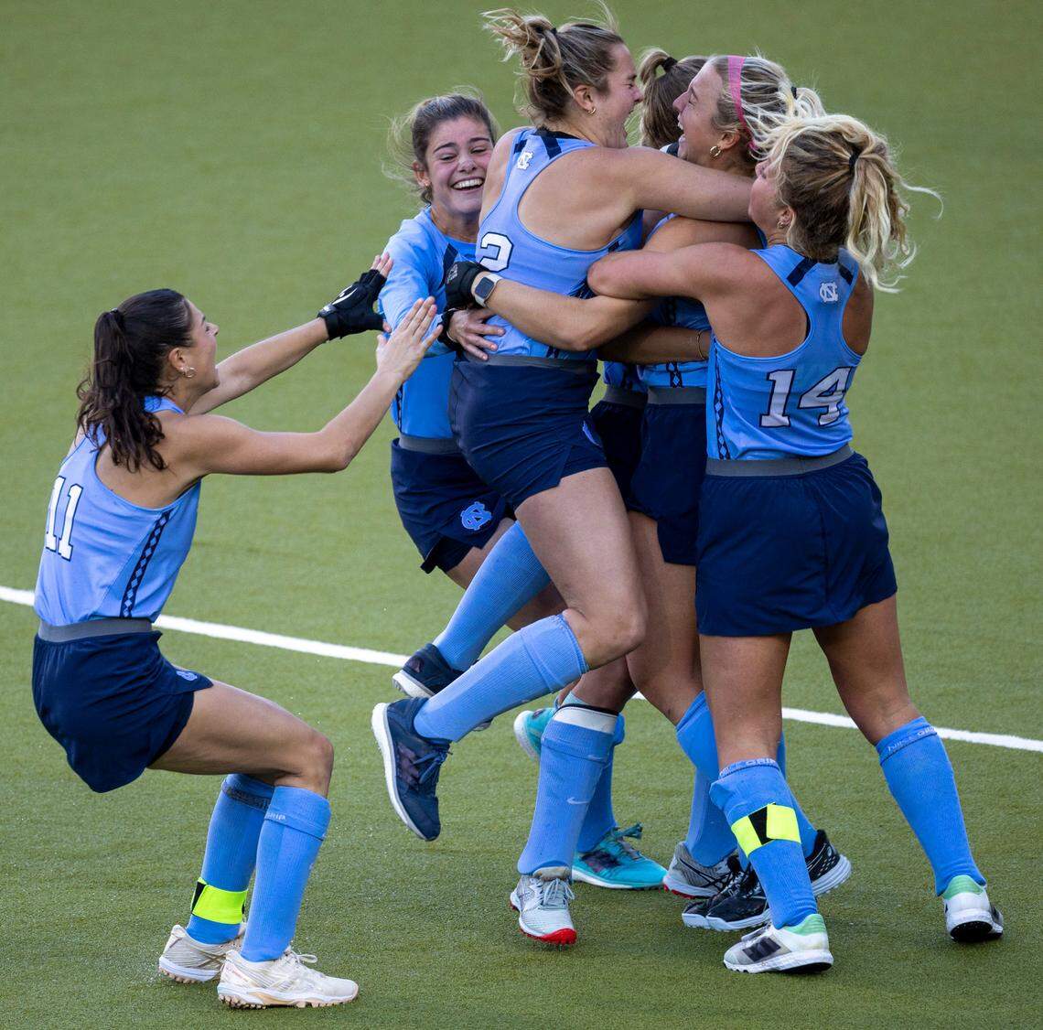 North Carolina’s Charly Bruner (2) embraces Ryleigh Heck (12) after she scored the game winning goal in a sudden death shootout on Northwestern goalie Annabel Skubisz to clinch the NCAA Division I Field Hockey Championship on Sunday, November 19, 2023 at Karen Shelton Stadium in Chapel Hill, N.C.