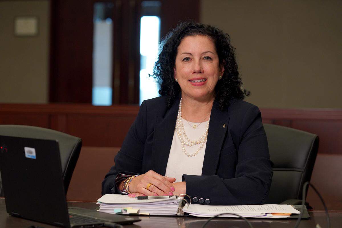 Melanie Shekita sitting at desk
