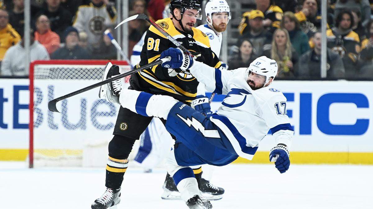 Boston Bruins defenseman Dmitry Orlov (81) checks Tampa Bay Lightning left wing Alex Killorn (17) during the second period at TD Garden.