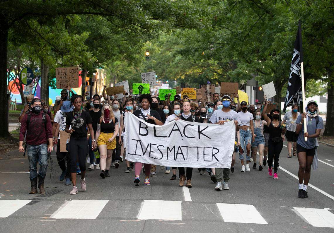 Protesters march from Moore Square up Blount Street to The Executive Mansion honoring those who died or faced excessive force at the hands of Raleigh police on Tuesday, June 9, 2020 in Raleigh, N.C.