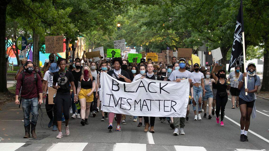 Protesters march from Moore Square up Blount Street to The Executive Mansion honoring those who died or faced excessive force at the hands of Raleigh police on Tuesday, June 9, 2020 in Raleigh, N.C.