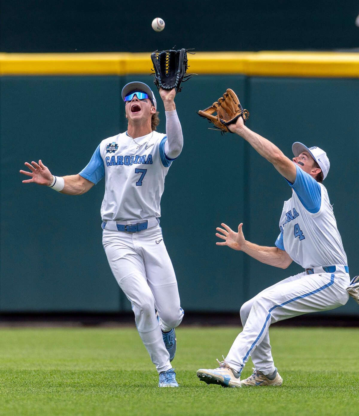 North Carolina outfielder Vance Honeycutt (7) fields a fly ball by Florida State short stop Alex Lodise in the second inning during game nine of the College World Series on Tuesday, June 18, 2024 at Charles Schwab Field in Omaha, Nebraska.