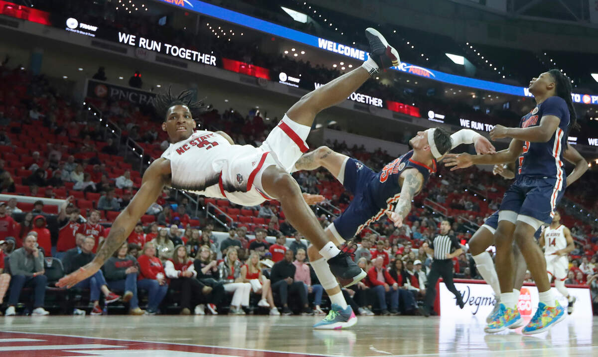N.C. State’s MJ Rice (3) goes down after being fouled by UT Martin’s Jacob Crews (35) during N.C. State’s 81-67 victory over UT Martin at PNC Arena in Raleigh, N.C., Tuesday, Dec. 12, 2023.