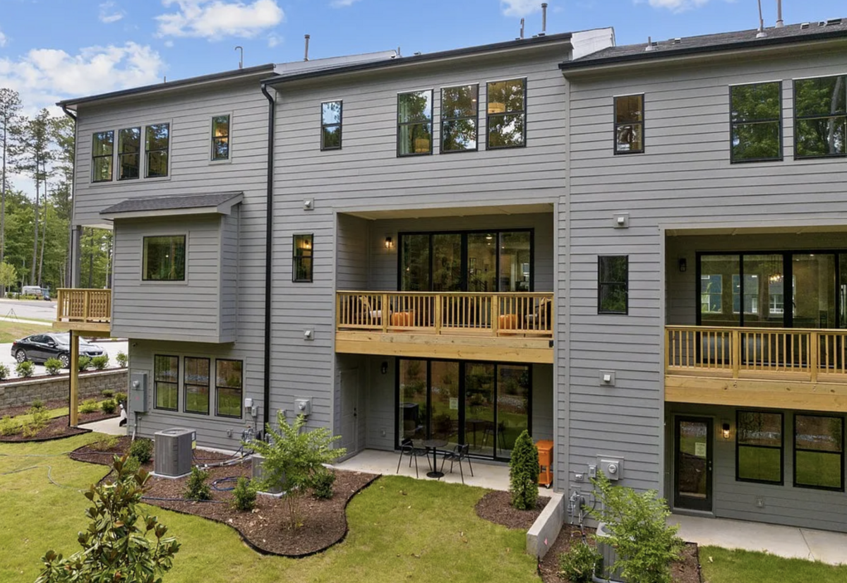 The back view of a block of townhomes in Tri Pointe Homes’ new Elm Park at 4707 Mint Leaf Ln. off Duraleigh Road in Raleigh. 