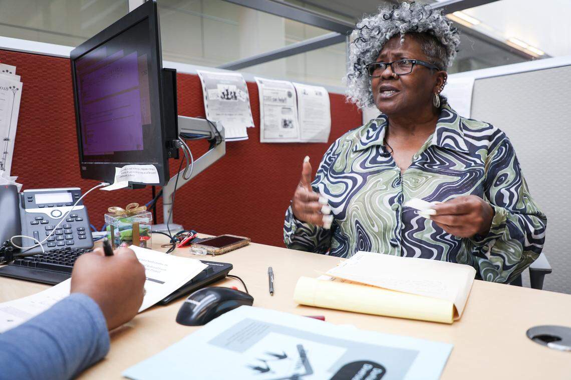Rosemary Abram explains to an employee at the Durham County Human Services Department that she is being evicted from her home due to gentrification on Friday May 18, 2018.
