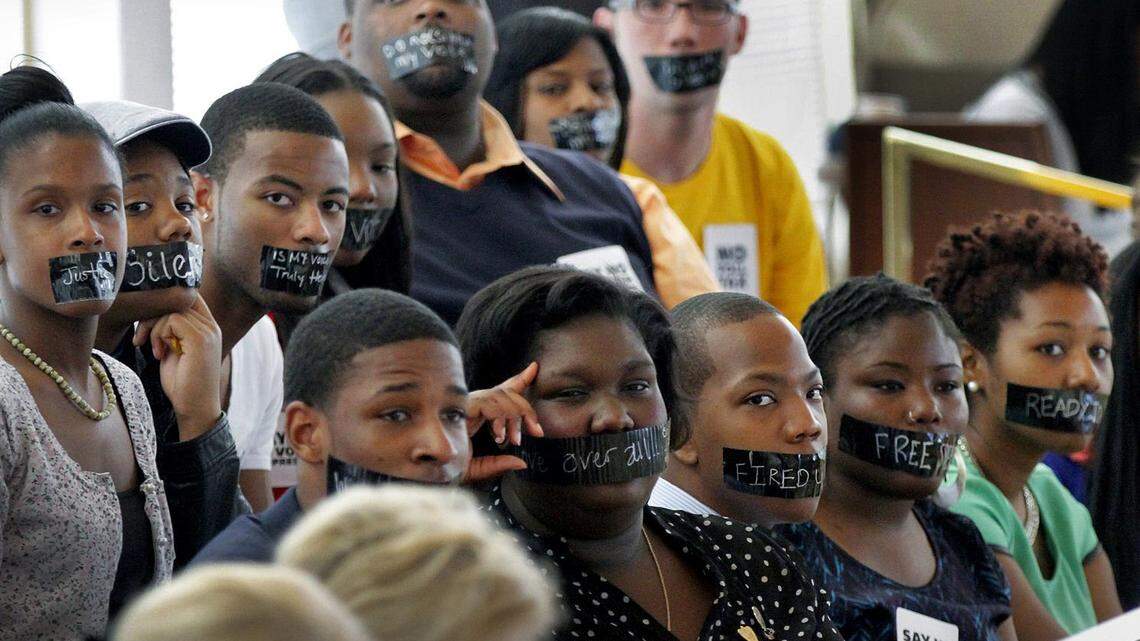 Opponents of a voter ID bill being debated at the Legislative Building in Raleigh, on April 24, 2013, wear black tape over their mouths as a sign of protest. The law was later ruled racially discriminatory and replaced by a different version in 2018 that faces similar accusations.