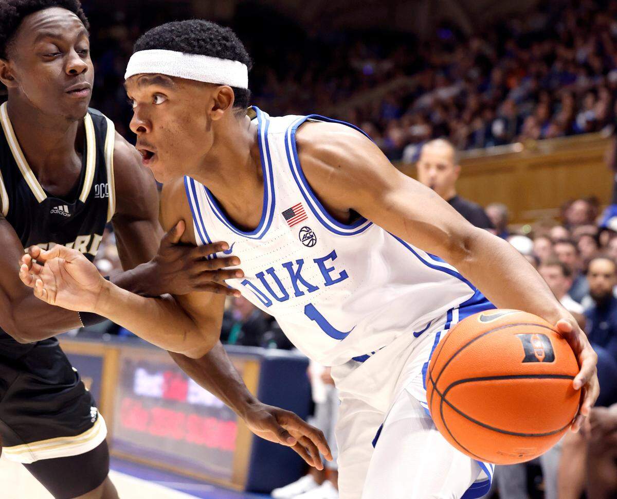 Duke’s Caleb Foster (1) drives past Wofford’s Justin Bailey (5) during the second half of Duke’s 86-35 victory over Wofford at Cameron Indoor Stadium in Durham, N.C., Saturday, Nov. 16, 2024.