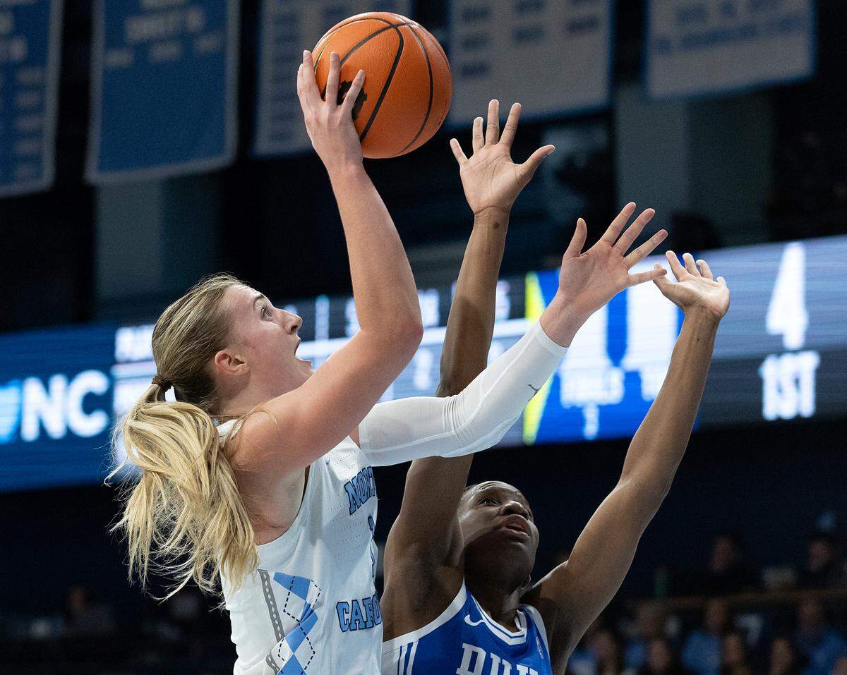 North Carolina’s Alyssa Ustby shoots over Duke’s Jadyn Donovan during the first half of the Tar Heels’ 53-46 overtime victory on Thursday, Jan. 9, 2025, at Carmichael Arena in Chapel Hill, N.C.