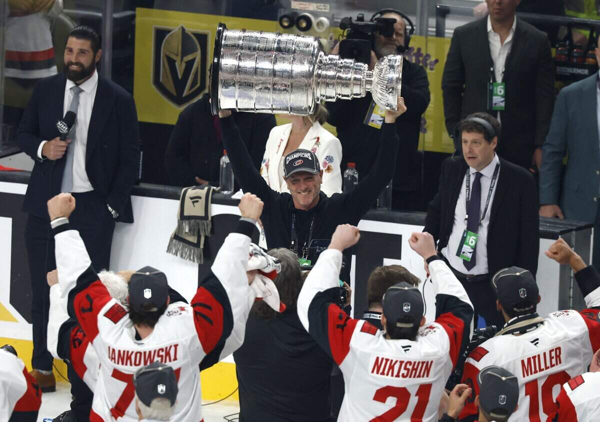 Carolina Hurricanes owner Tom Dundon raises the Cup after the Hurricanes’ 3-0 victory over the Vegas Golden Knights to win the Stanley Cup at T-Mobile Arena in Las Vegas, Nev., Sunday, June 14, 2026.