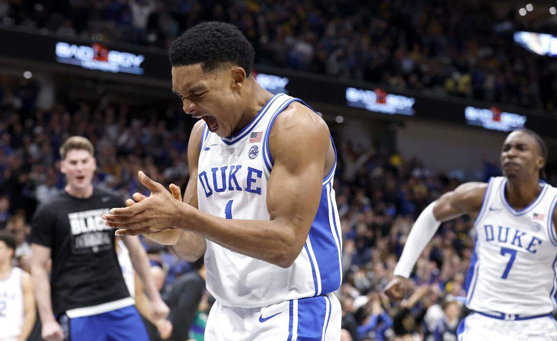 Duke’s Caleb Foster (1) and Dame Sarr (7) celebrate after Duke’s 68-63 victory over Michigan in the Capital Showcase at Capital One Arena in Washington, D.C., Saturday, Feb. 21, 2026.
