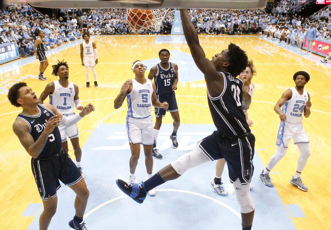Duke’s A.J. Griffin (21) slams in two during Duke’s 87-67 victory over UNC at the Smith Center in Chapel Hill, N.C., Saturday, Feb. 5, 2022.